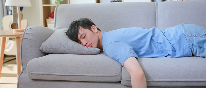 a man sleeping on a couch